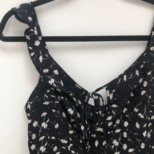 Black floral romper with adjustable ruffle straps